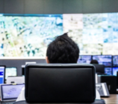 IT professional studying network data on screen during a Cisco live webinar
